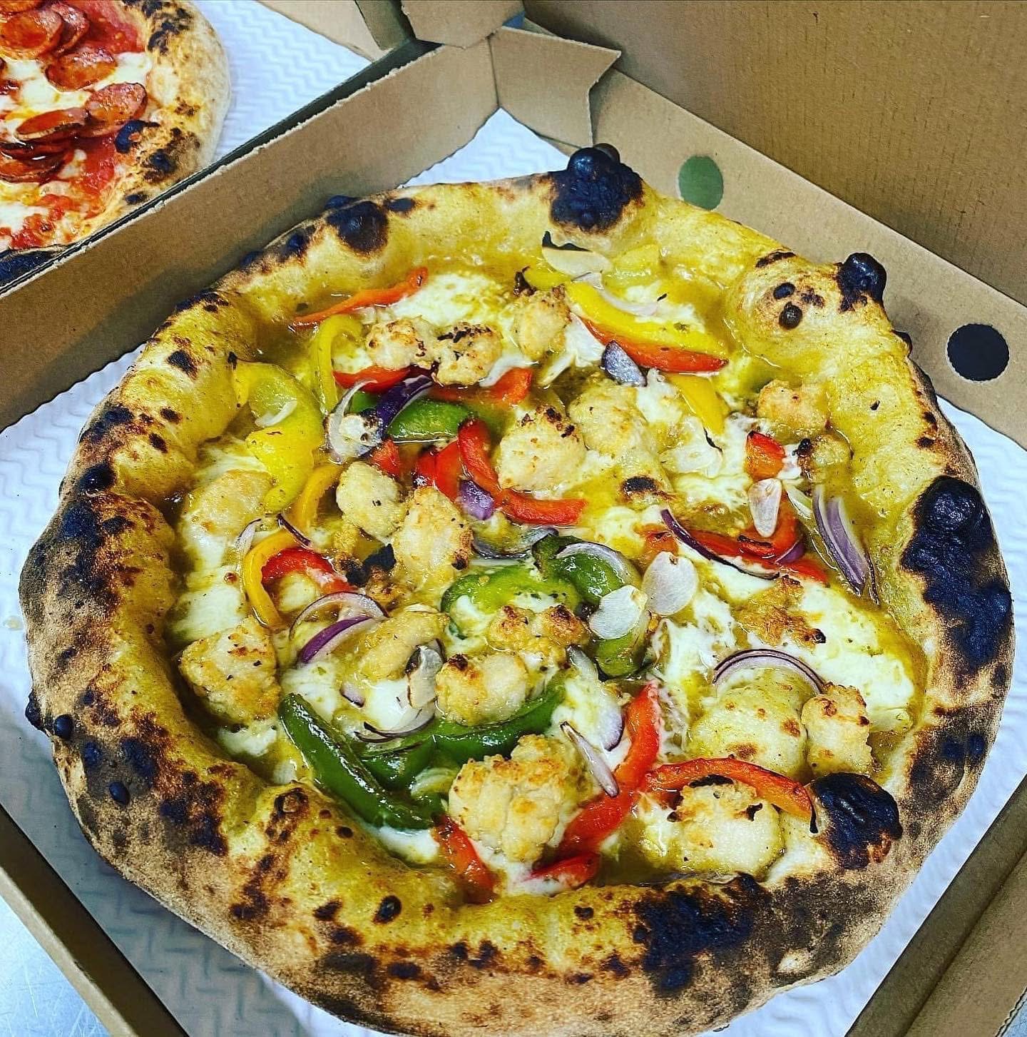 Award-winning Salt and Pepper Chicken pizza in a takeaway box